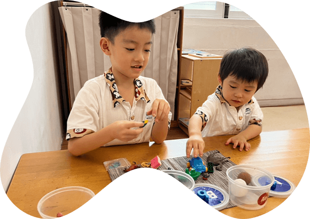 Our mixed-age classrooms — 2–17 months, 18 months–3 years, and 3–6 years — spark curiosity, friendship and growth. Older children develop leadership and empathy, while younger ones gain inspiration and confidence. Together, they thrive in a dynamic, nurturing community that fosters social skills and creativity.